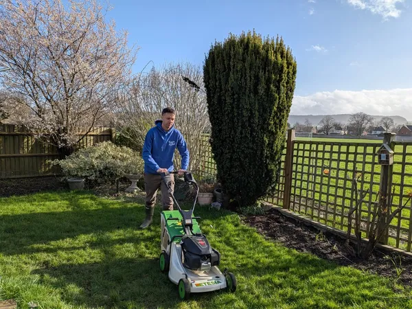 Professional lawn mowing service in action